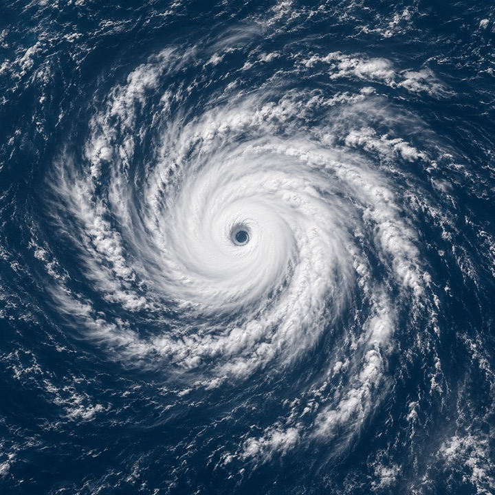 Original conceptual illustration of a spiral storm over open ocean, not a satellite observation.